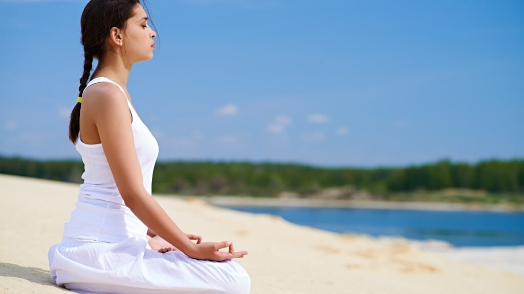 symptomatic relief, a girl on the beach meditating